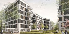 Moderne Wohnanlage mit mehreren Gebäuden, umgeben von Bäumen und blühenden Pflanzen, die eine einladende Atmosphäre schaffen.