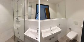 Ein modernes Badezimmer mit einer gläsernen Dusche, einem eleganten Waschbecken und einem minimalistischen WC in neutralen Farben.